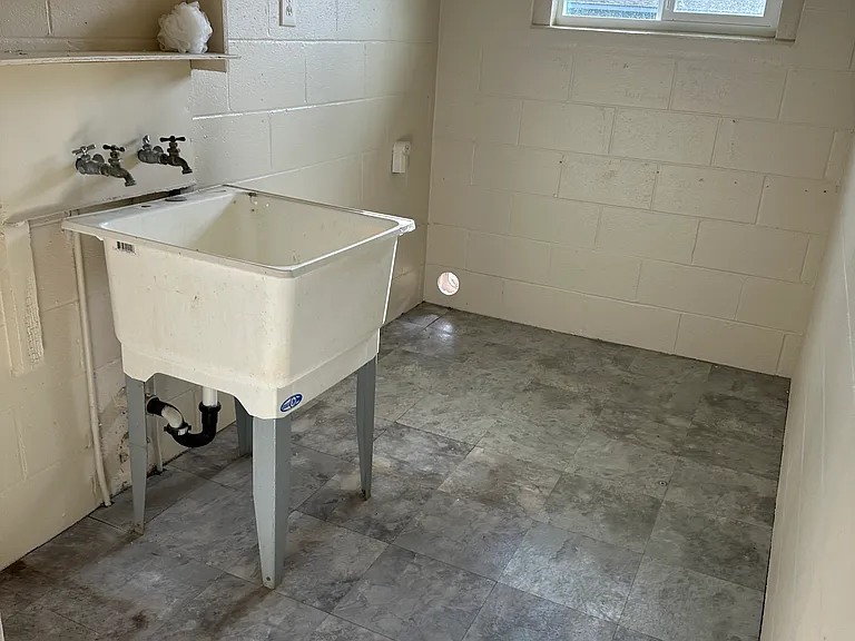 Laundry room with hookups for washer/dryer. Located in the extension