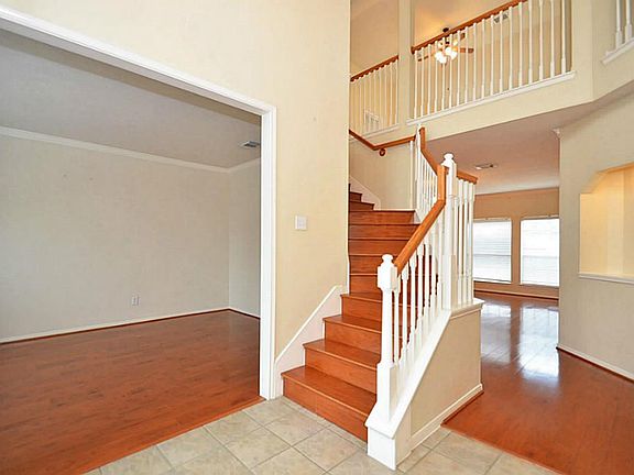 Stairs leading up to 4 bedrooms upstairs and 2 game rooms up!