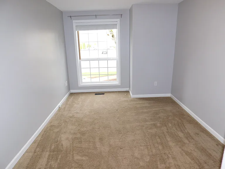 Front bedroom 9' by 12' with large window