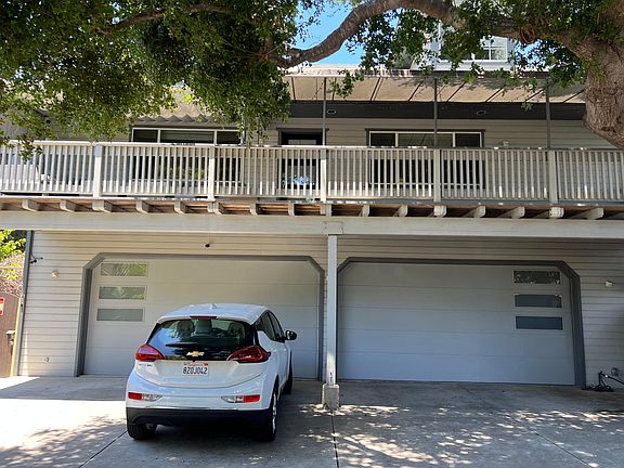 View of the property and 2nd floor penthouse above the trees