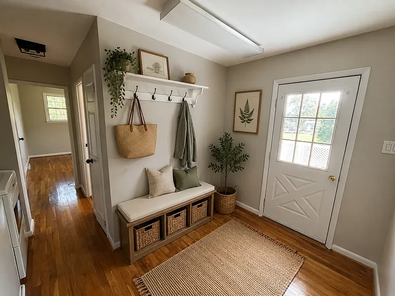 Bright rear entry with laundry area and plenty of room to create a practical mudroom for coats, shoes, and extra storage.