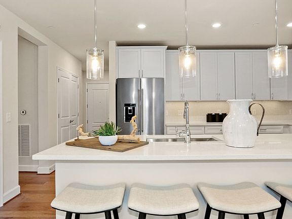 Kitchen with Peninsula Island Provides Ample Workspace and Storage