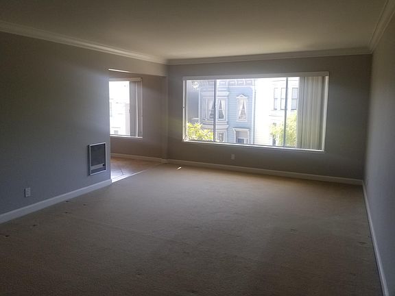 Living room and part of the dining area/ entrance to the kitchen