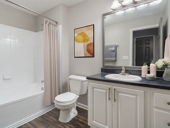 Bright bathroom with tub and shower combination