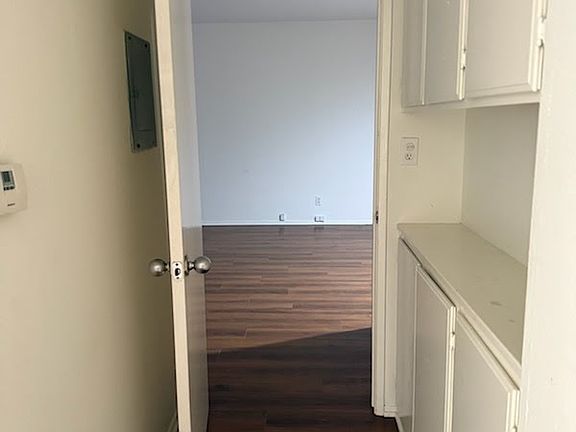 Entry to bedroom with linen closet
