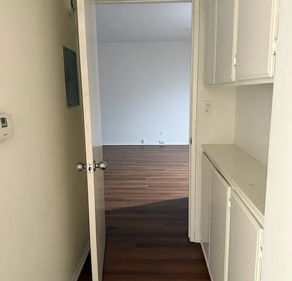 Entry to bedroom with linen closet