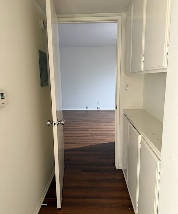 Entry to bedroom with linen closet