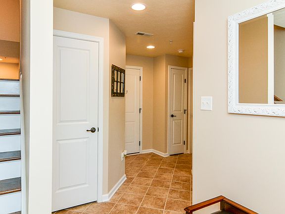 Entry with coat closet and storage closet