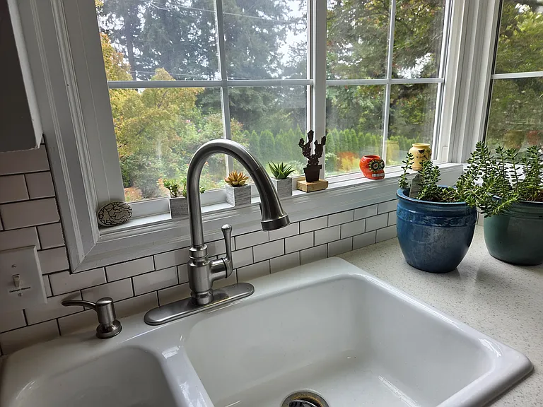 Enjoy your daily routine with dual sinks designed to maximize your stunning window view