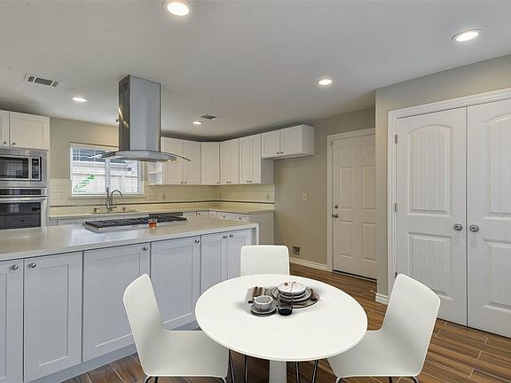 Fantastic kitchen fully updated with stainless steel appliances, subway tile backsplash, and desirable gas stove top.