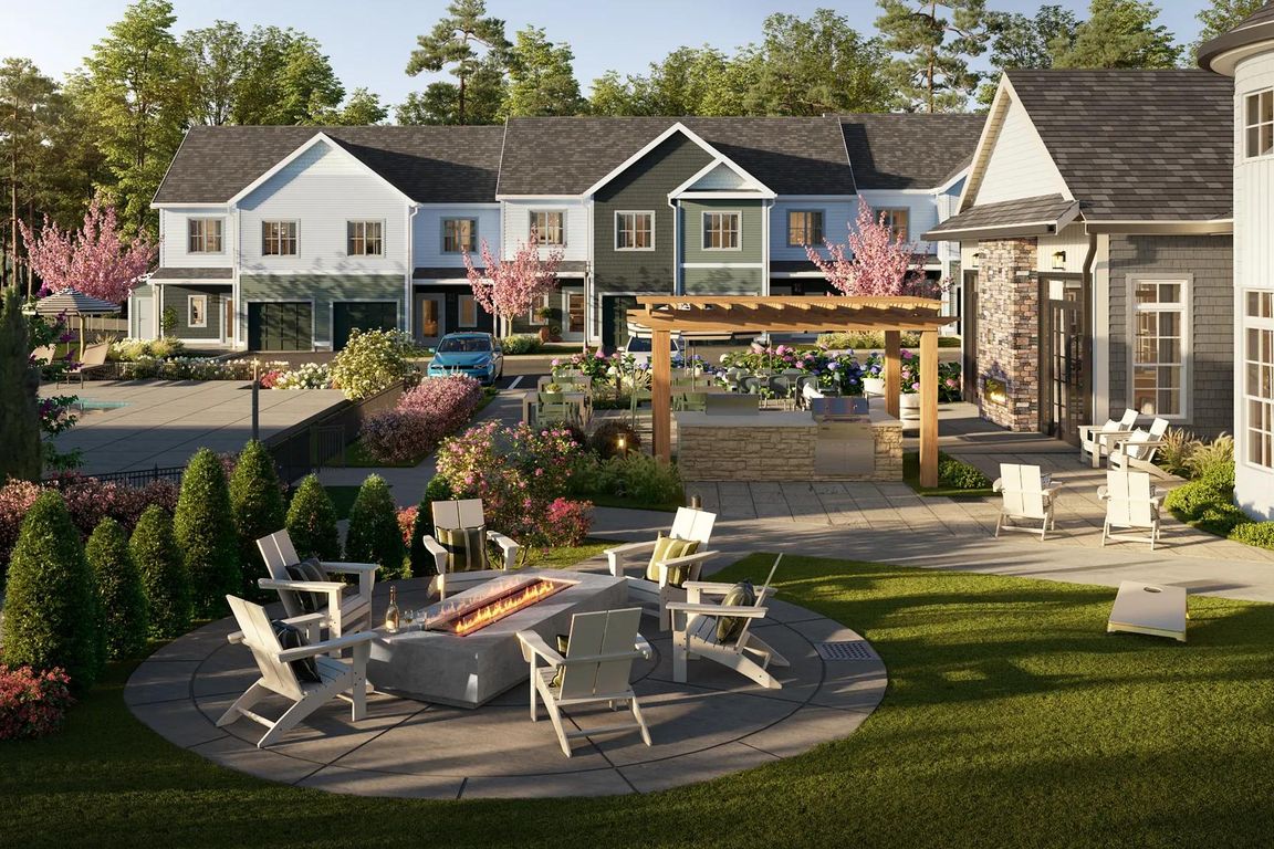 Activity lawn with outdoor games, firepit, grills, and comfortable seating.