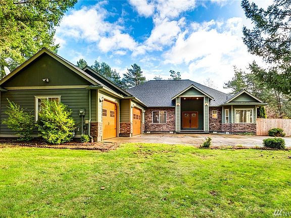 As you pull into the driveway you are greeted with a large and open entry and a roomy 3 car garage. To the right of the house is a double gated fence.