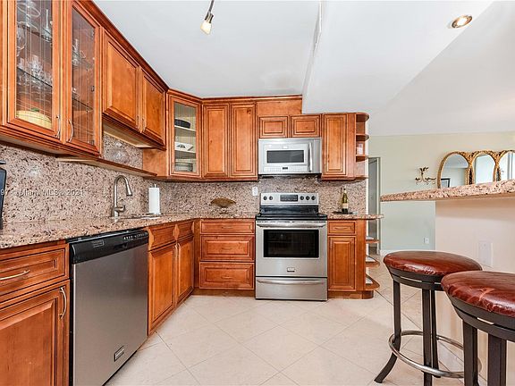 Beautiful Kitchen with custom made wood cabinets and granite counters