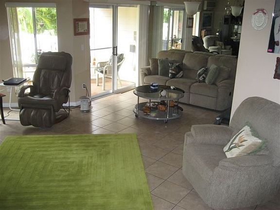 Gigantic living rm w/cathedral ceilings and views of golf course