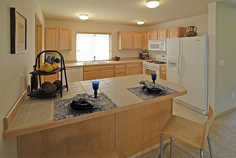 The kitchen and family room are open and light