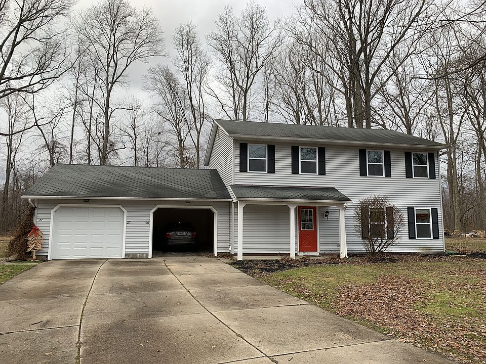 Street view. Front colonial unit is for rent. Ranch behind garage is occupied.