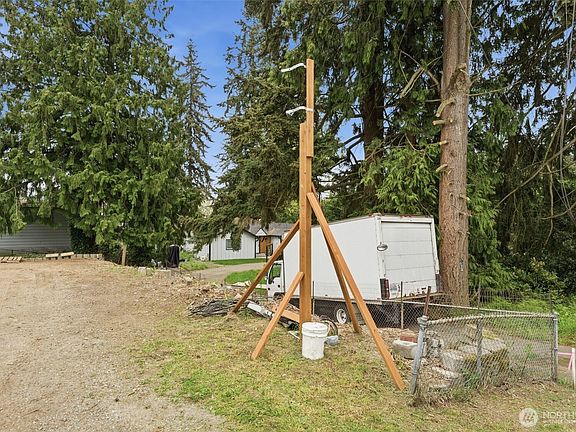 Temporary power pole and utility work already in place to support future construction. Infrastructure progress helps streamline your development timeline.>