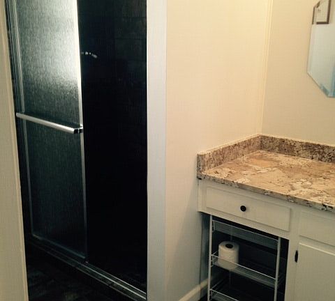 bath with tile and granite