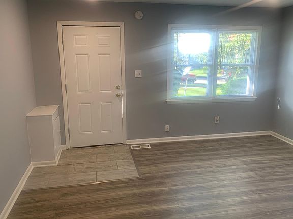 Ceramic tile front door entry with all New Laminate living room flooring