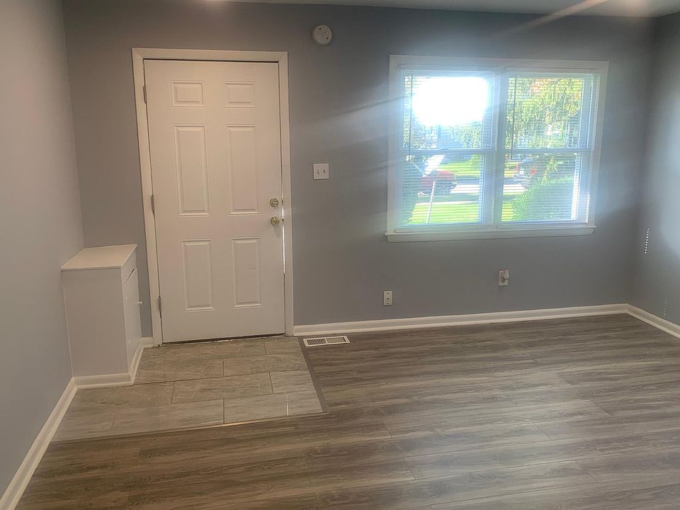 Ceramic tile front door entry with all New Laminate living room flooring