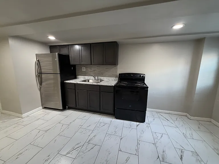 1115 E Upsal St #BASEMENT — Photo 1