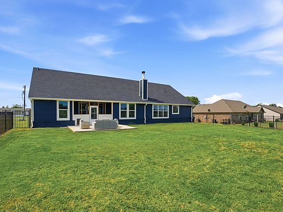 Unlimited possibilities in your backyard---add a future pool, workshop or outbuilding, guest house.  In addition to the patio, the sellers enclosed the back porch for their pets. Makes an ideal sunroom too.