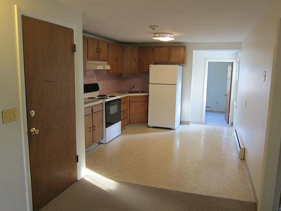 Kitchen and view towards utility room at rear of apartment.