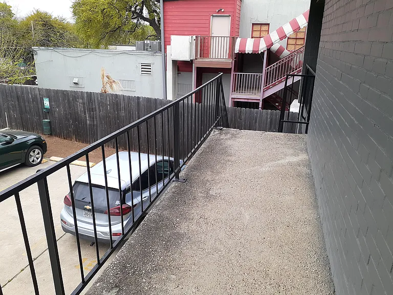 VIEW OF ASSIGNED PARKING SPOT FROM THE FRONT DOOR