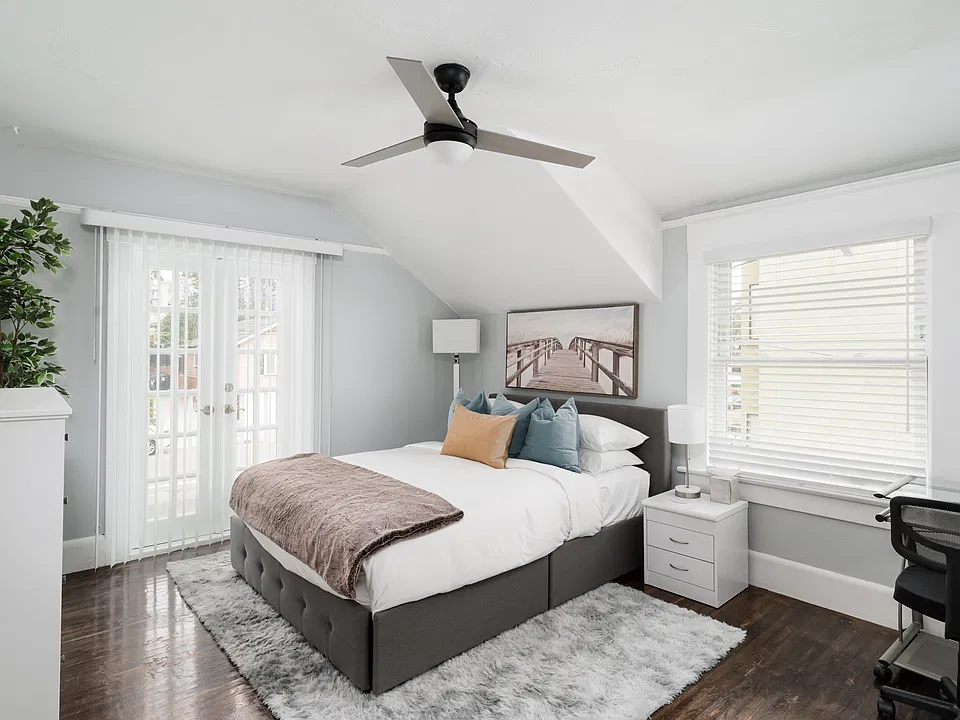 Bedroom 1 - queen size bed with French doors leading to private balcony.