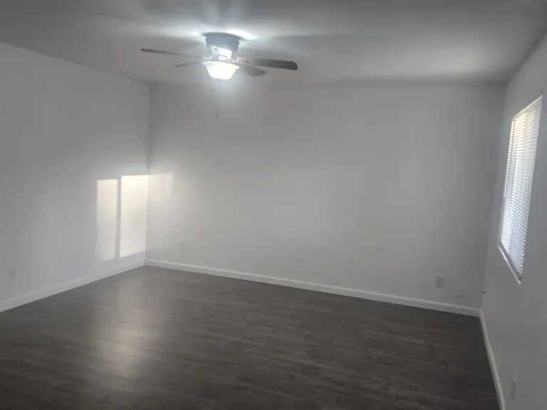 Large living room with new dual pane windows.