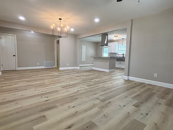 Living room opens to kitchen