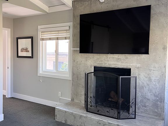 Primary bedroom fireplace and bigscreen tv