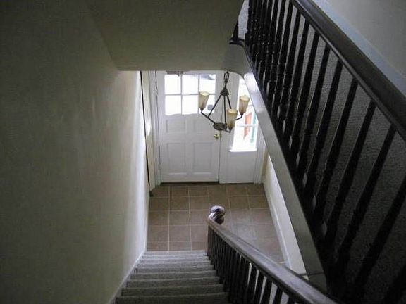 view down stairs to entry