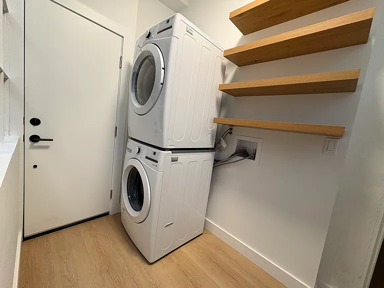 New washer/dryer. Large laundry/storage room.