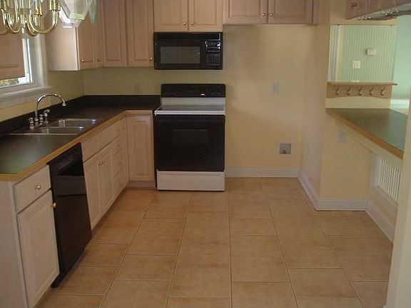Updated kitchen w/high quality tile flooring, trimwork, cabinets & appliances.