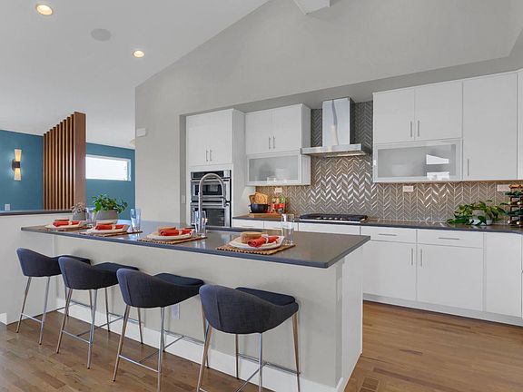Expansive kitchen featuring a large island, providing additional seating