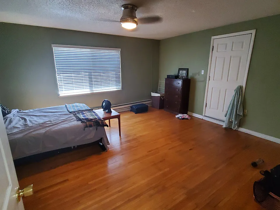 This spacious 16' x 14' primary bedroom provides ample room for a king bed, additional furniture, or a work-from-home setup.