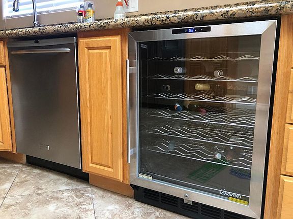 Wine refrigerator and dishwasher.