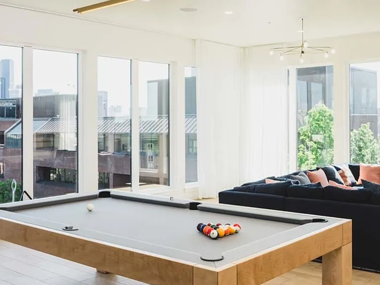 Clubroom with chic lounge areas and a pool table
