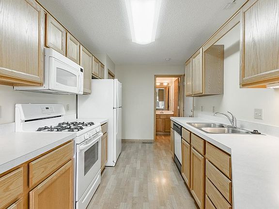 Lots of space to work - main floor half bath beyond the kitchen and garage access
