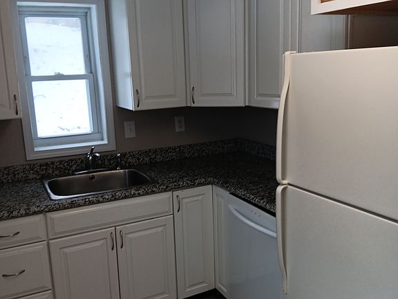Kitchen granite and garbage disposal.