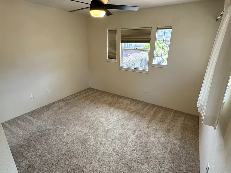 Second bedroom with new remote control ceiling fan.