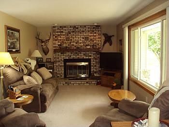 The living room has a gas log fireplace.