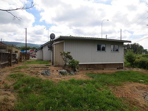 Back view. Just past the small storage area with the satellite dish is an entry door into the apartm