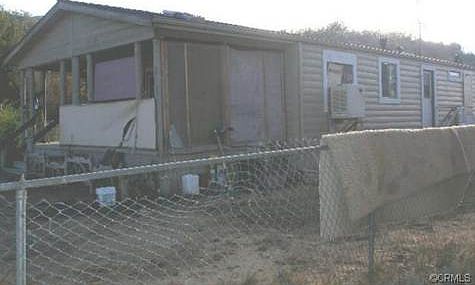 EAST END AND REAR OF MOBILE, (NOT COVERED FRONT PORCH AND READ A