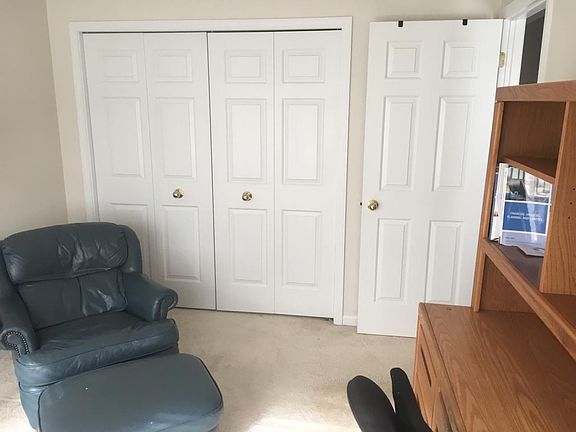 Spare room/Office Closet space with shelves and clothing ra
