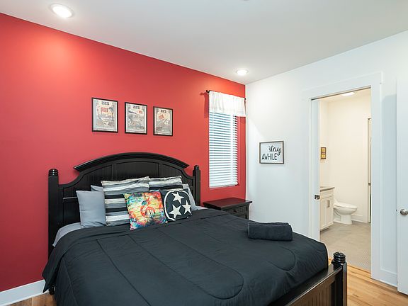 Bedroom 2 features a king size bed and ensuite bath with large shower and large walk-in closet.
