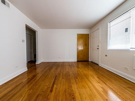 Spacious living room at 7706 S Saginaw!