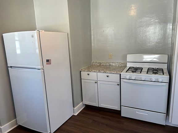 Used stove and fridge with extra storage and contertop space. New kitchen flooring.