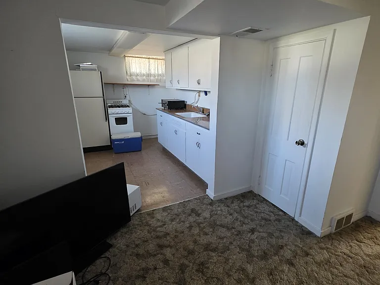 Basement includes extra living space, as well as a kitchenette. Perfect for people wanting additional living space or to accommodate guests.
